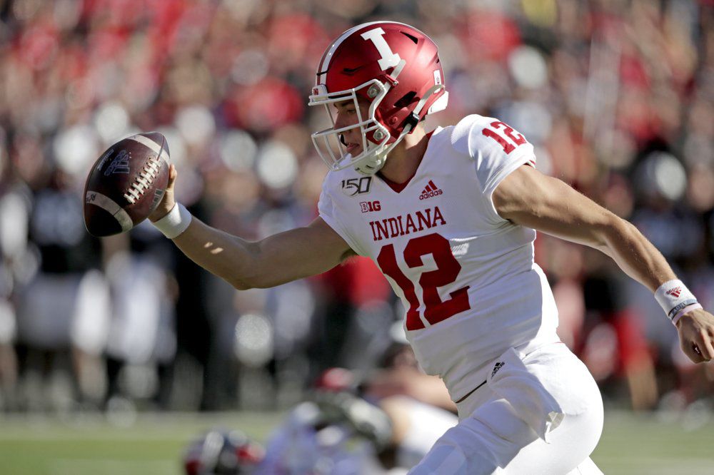 Indiana quarterback Peyton Ramsey (12) reaches with the ball